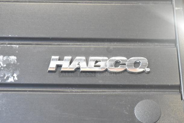 2019 Habco SE18 Commercial Single Door Cooler; logo detail, 115 Volts, 1 Phase; black surface, minor wear visible.