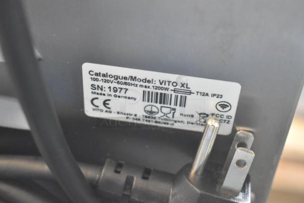Label on Vito Fryfilter VITO XL, showing model, voltage (100-120V), and serial number, made in Germany.