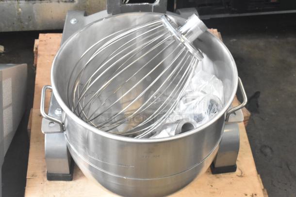 "Brand new Avantco MX40H floor-style dough mixer with bowl, bowl guard, paddle, whisk, dough hook; minor scratches visible."