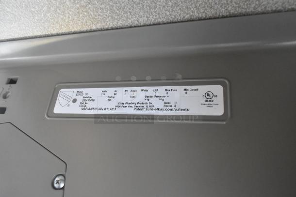 Brand new Elkay EZFSD_1H wall mount water fountain, 115V, 1 Phase. Label shows serial and model numbers, UL listed.