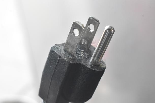 Close-up of a three-prong electrical plug for a 2025 Bunn 22100.0000 G3 HD coffee grinder.