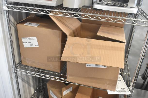 Brand new scratch and dent lot with 512XKD710BK and other deli tags, visible box labels, multiple packs included.