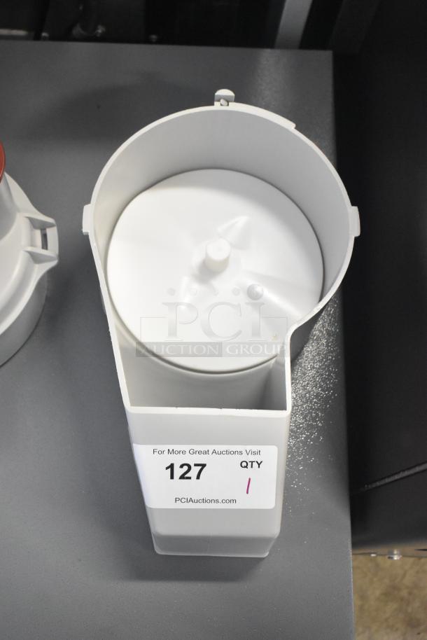 Gray poly continuous feed head attachment for food processor, new with minor scratches. Auction label "127 QTY 1" visible.