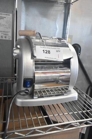 Brand new Imperia NSP countertop pasta machine with minor scratches, featuring a silver finish, power switch, and tag indicating "128 QTY".