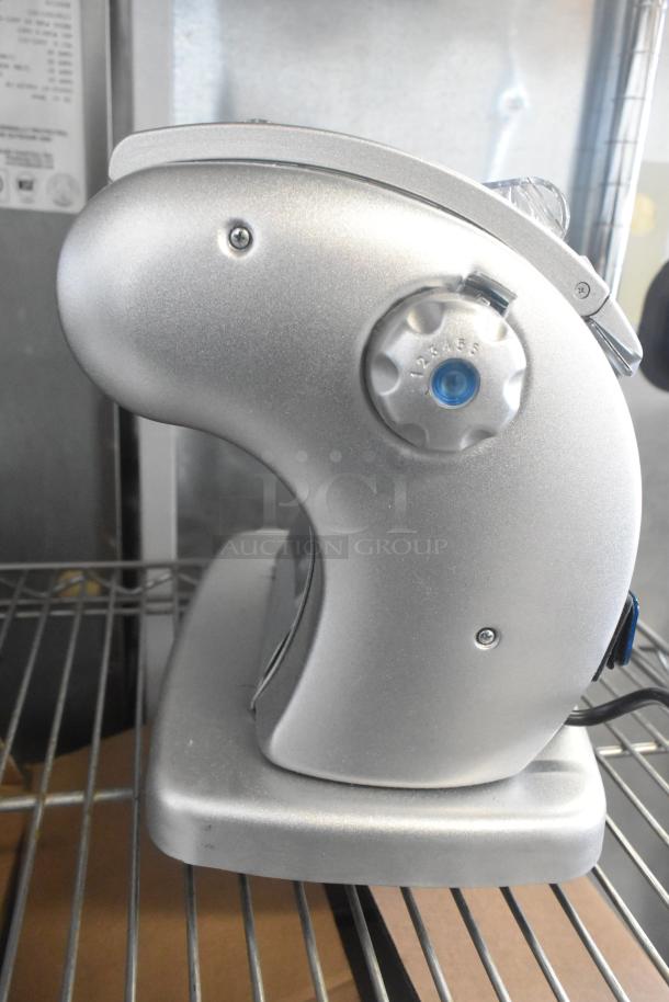 Brand new Imperia NSP countertop pasta machine with minor scratches; sleek silver design, adjustable settings, in excellent condition.