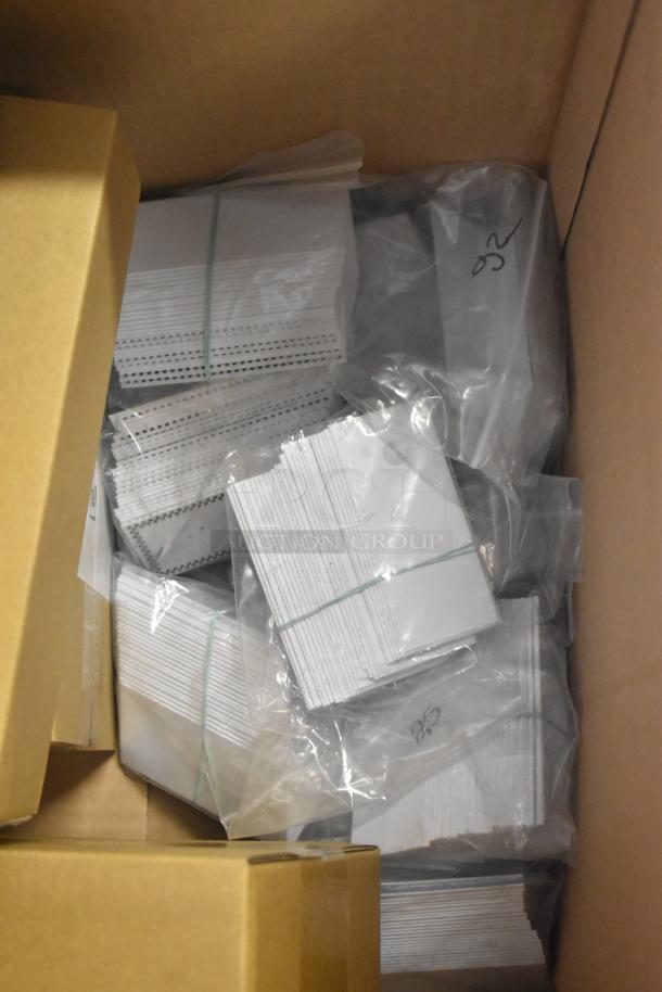 Pack of 25 brand new, scratch and dent 512XKD707BK rectangular write-on deli tent signs with black checkered border.