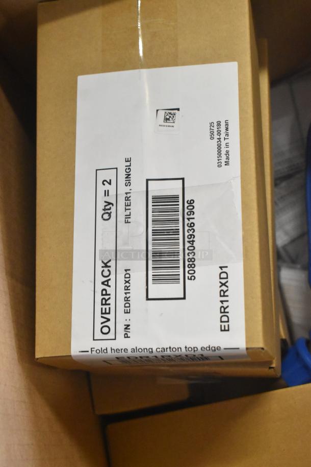 Brown cardboard box with a shipping label showing barcode and production details. Box shows minor wear.