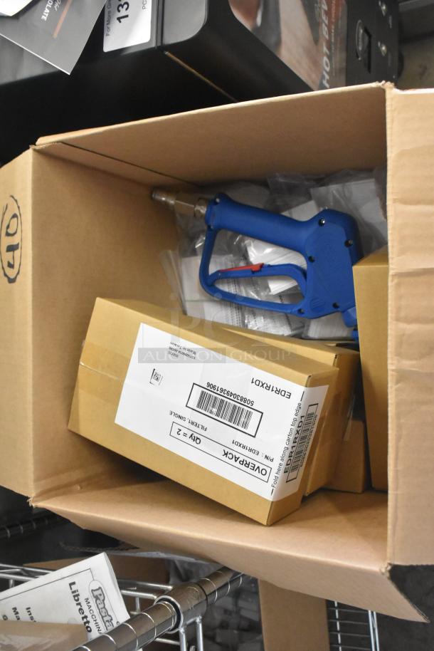 Cardboard box containing 512XKD707BK Write-On Deli Tent Signs with black checkered border, brand new, 25/Pack.