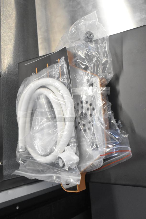 Brand new Avantco 177PBD3 cappuccino/hot chocolate machine; visible accessories in sealed packaging, slight scratches.