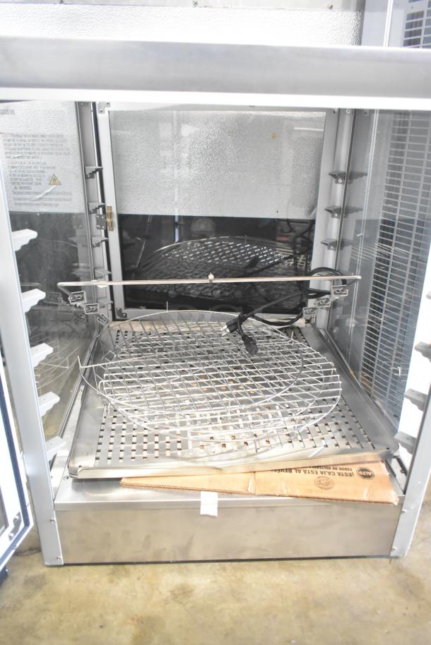 Brand new countertop warming display case, 115 volts, 1 phase. Slight scratches and dents. Includes wire rack and packaging.