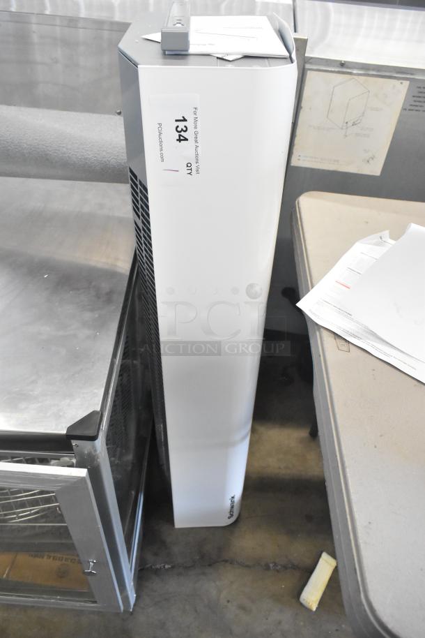 Brand new Schwank AC-KA36-23 air curtain, 208V, 1 phase. Visible tag indicates "134 QTY PDCAuctions.com". Minor scratches.
