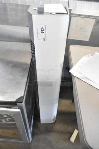 Brand new Schwank AC-KA36-23 air curtain, 208V, 1 phase. Visible tag indicates "134 QTY PDCAuctions.com". Minor scratches.