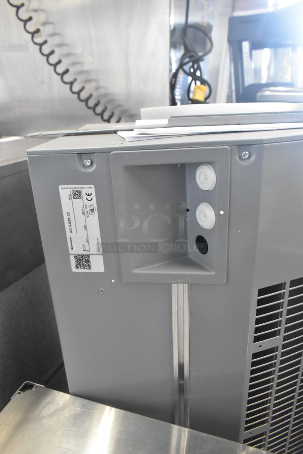 Brand new Schwank AC-KA36-23 air curtain, 208V, 1-phase, with minor scratches. Includes visible labels and specifications.