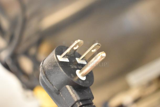 Close-up of the power plug for the Avantco 177RCSB90 rice cooker, showing a standard three-prong connector.