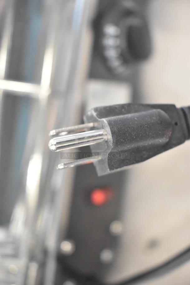 Avantco 177HDC13 countertop heated display case plug detail, showcasing the power connection feature.