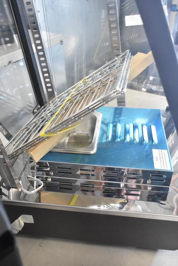 Brand new Avantco 177HDC13 15" countertop heated display case. Features three shelves, hinged doors, and 120V, 1-phase power.