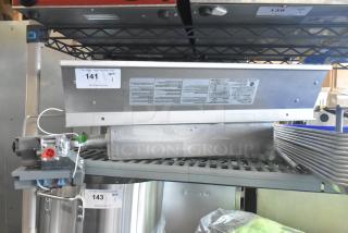 Brand new Heatstar 4000 Series radiant gas heater, 40,000 BTU, spark ignition. Visible tags list model F140629. Scratch and dent condition.