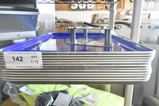 Stack of 13 new aluminum bun pans, 18"x26", 19 gauge, with quantity tag, auction info, and plastic-covered Robot Coupe piece.