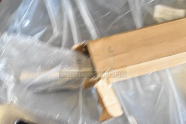 Blurry image of cardboard packaging, likely containing Avantco 177EG24N griddle. Griddle is new with some scratches.