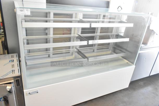Brand new Avantco 193BCFD72W 70 7/8" white bakery display case with LED lighting, commercial casters, 110-120V.