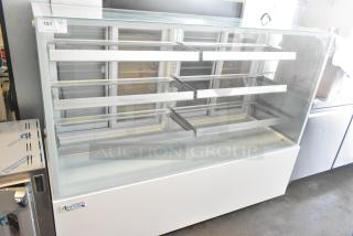 Brand new Avantco 193BCFD72W 70 7/8" white bakery display case with LED lighting, commercial casters, 110-120V.