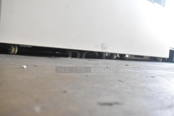 Brand new Avantco 193BCFD72W white bakery display case, scratch and dent, LED lighting, on commercial casters, 70 7/8" wide.