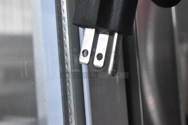 Close-up of the power plug for the Avantco 193BCFD72W bakery display case, showing standard prongs and a CE marking.