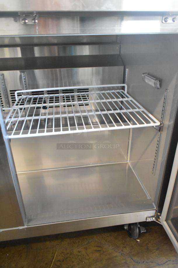 Avantco 178SSUC48RHC 2 Door Work Top Cooler, stainless steel, commercial casters, 115V, 1 Phase, interior shelving visible.