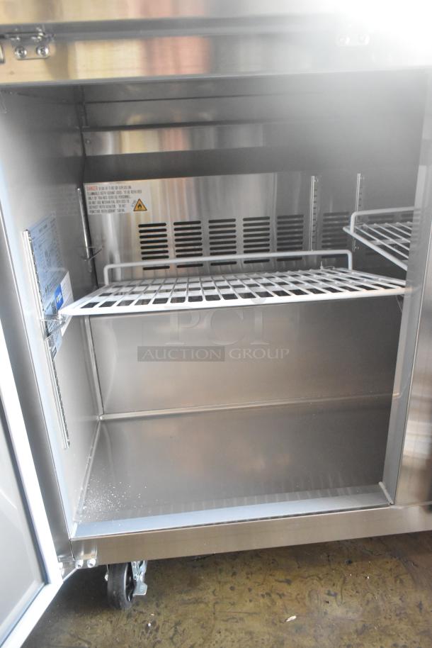 Avantco 178SSUC48RHC commercial 2-door work top cooler on casters, 115V, stainless steel, interior shelving, model label visible.