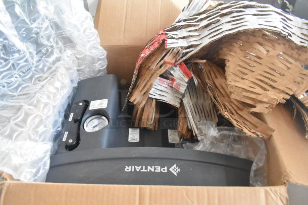 Pentair Everpure EZ-RO BL Reverse Osmosis System in box with protective packaging, gauge, and labels visible.