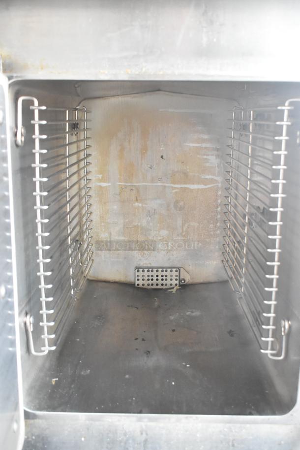 2016 Cleveland 24CGA10.2 Commercial Gas Steam Cabinet interior; dual decks, used condition, 72,000 BTU capacity.