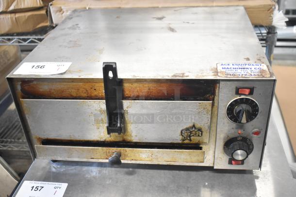 Star P012 countertop electric pizza oven, used condition, 120 volts, single phase, visible dials and Star logo.