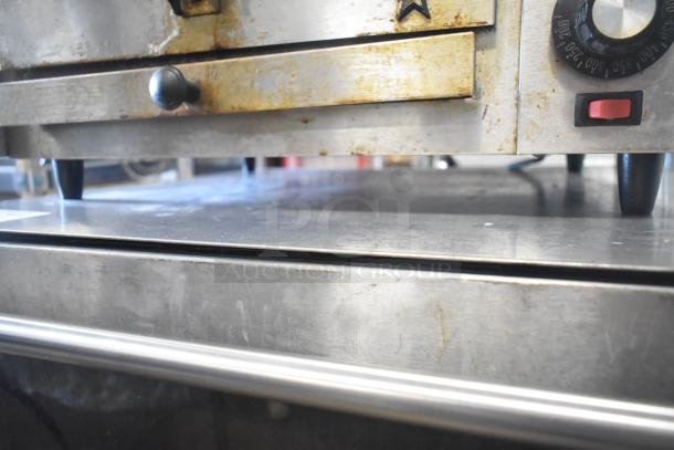 Star P012 Countertop Electric Pizza Oven, 120V, 1 Phase. Used condition with visible wear, featuring temperature dial and red power switch.