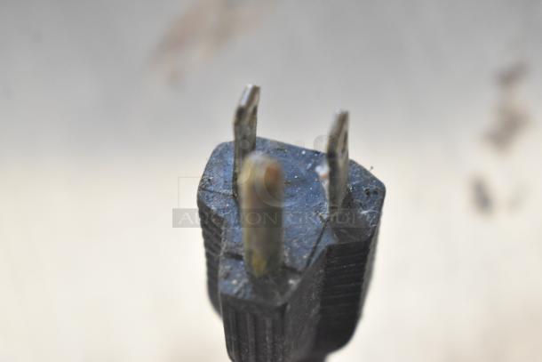 Close-up of a power plug for the Star P012 countertop electric pizza oven, 120 volts, single phase, slightly worn.