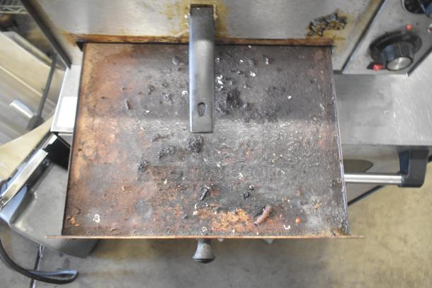 Star P012 Countertop Electric Pizza Oven, 120 Volts, 1 Phase, shows signs of heavy use with a worn, discolored cooking surface.