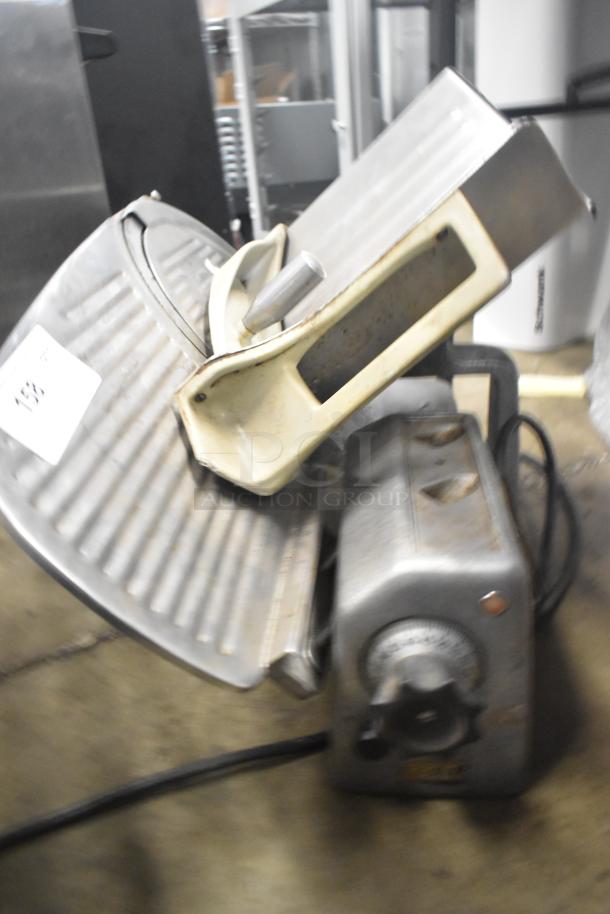 Hobart countertop meat slicer, 115 volts, 1 phase. Features adjustable thickness dial, metal construction, used condition.