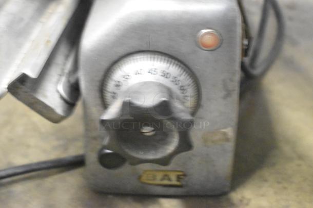 Hobart countertop meat slicer, 115 volts, 1 phase. Features a control dial and power indicator light. Used condition.