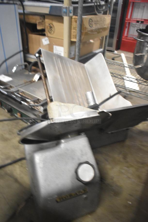 Hobart countertop meat slicer, 115 volts, 1 phase, showing metal construction. Appears in used condition.