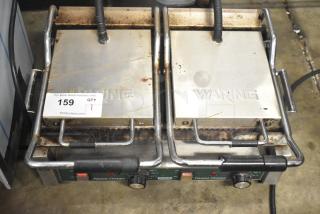 Waring WPG300 countertop double panini press, stainless steel, visible wear, 240 volts, single phase, model WPG300.