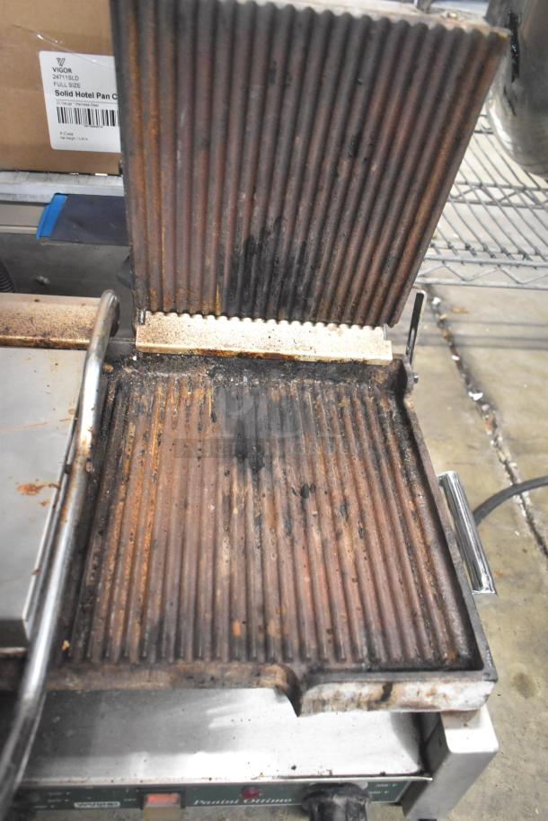 Waring WPG300 Countertop Double Panini Press, 240V, used condition, visible wear on grill plates, no tags or labels shown.