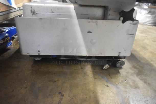 Bizerba commercial countertop meat slicer stacker, 115 volts, 1 phase, metal body, visible wear, power cord attached.