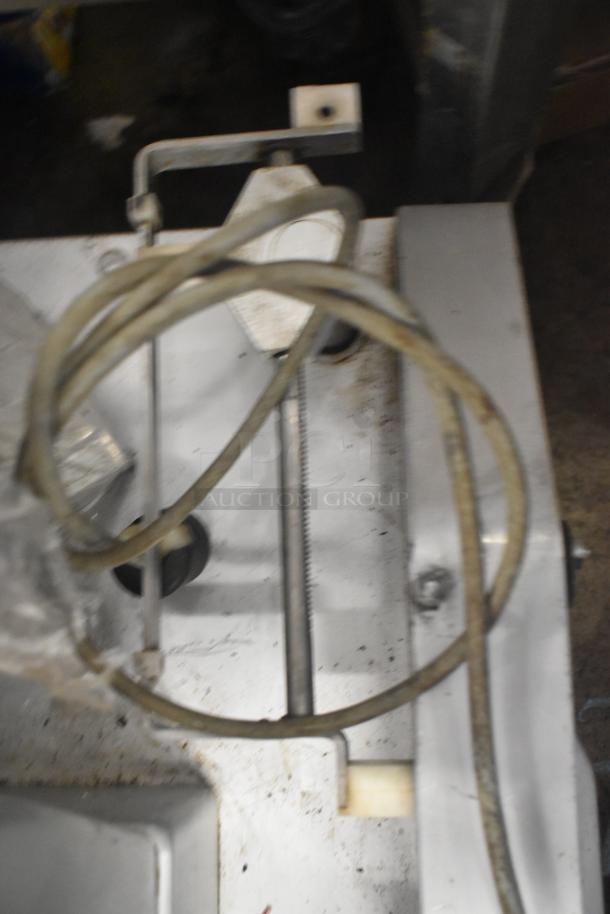 Bizerba Commercial Countertop Meat Slicer Stacker, 115V, 1 Phase. Visible wear, metal construction, power cord attached.