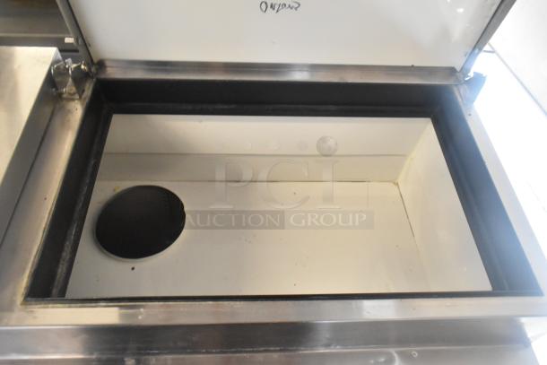 True TPP-60 Commercial Pizza Prep Table, stainless steel, on casters, 115V, 1 phase, interior view, durable condition.