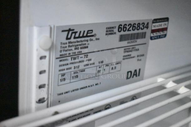 True TWT-72 Commercial 3 Door Work Top Cooler, 115V, on casters. Model and serial labels visible. Made in USA.