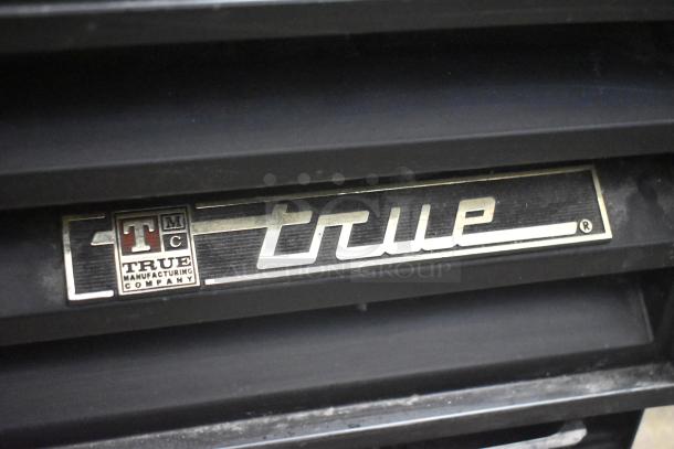 True GDM-12 cooler label, features durable construction. Model number and brand logo visible, indicating authenticity.