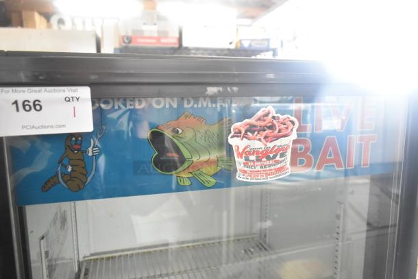 True GDM-12 single door cooler merchandiser. Used, 115V, 1 Phase. Features a live bait advertising sticker.