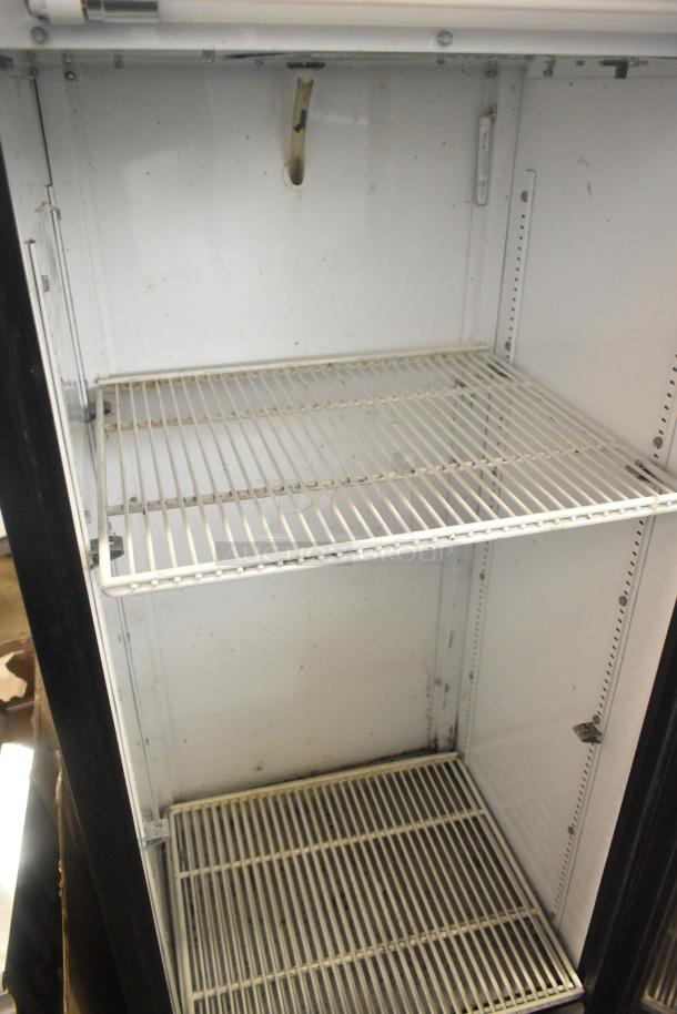 True GDM-12 Commercial Single Door Cooler, 115V, used condition, white interior, two wire shelves, needs cleaning.