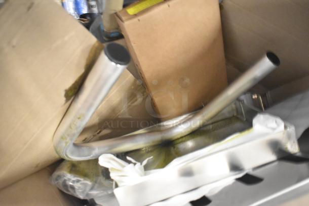 Brand new Robot Coupe R199 Robo-Cart, minor scratches and dents. Unassembled metal parts partially visible in packaging.