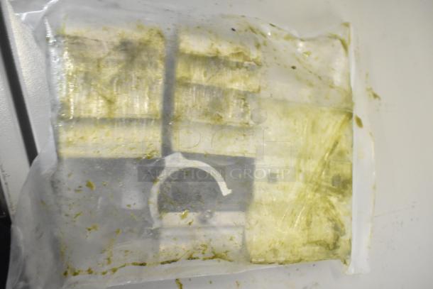 Brand new Robot Coupe R199 Robo-Cart, minor scratches and dents, plastic covering with visible discoloration. Appears unused.