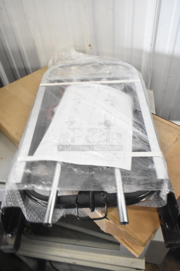 Brand new cart, partially wrapped, with assembly instructions visible, in scratch and dent condition.